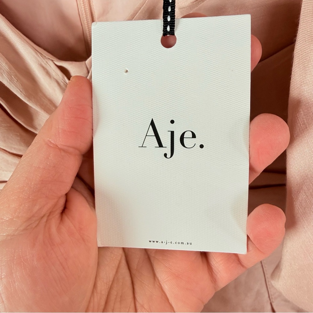 Aje. Dusk Knot Puff Sleeve Mini Dress in Blush - Picture 9 of 10